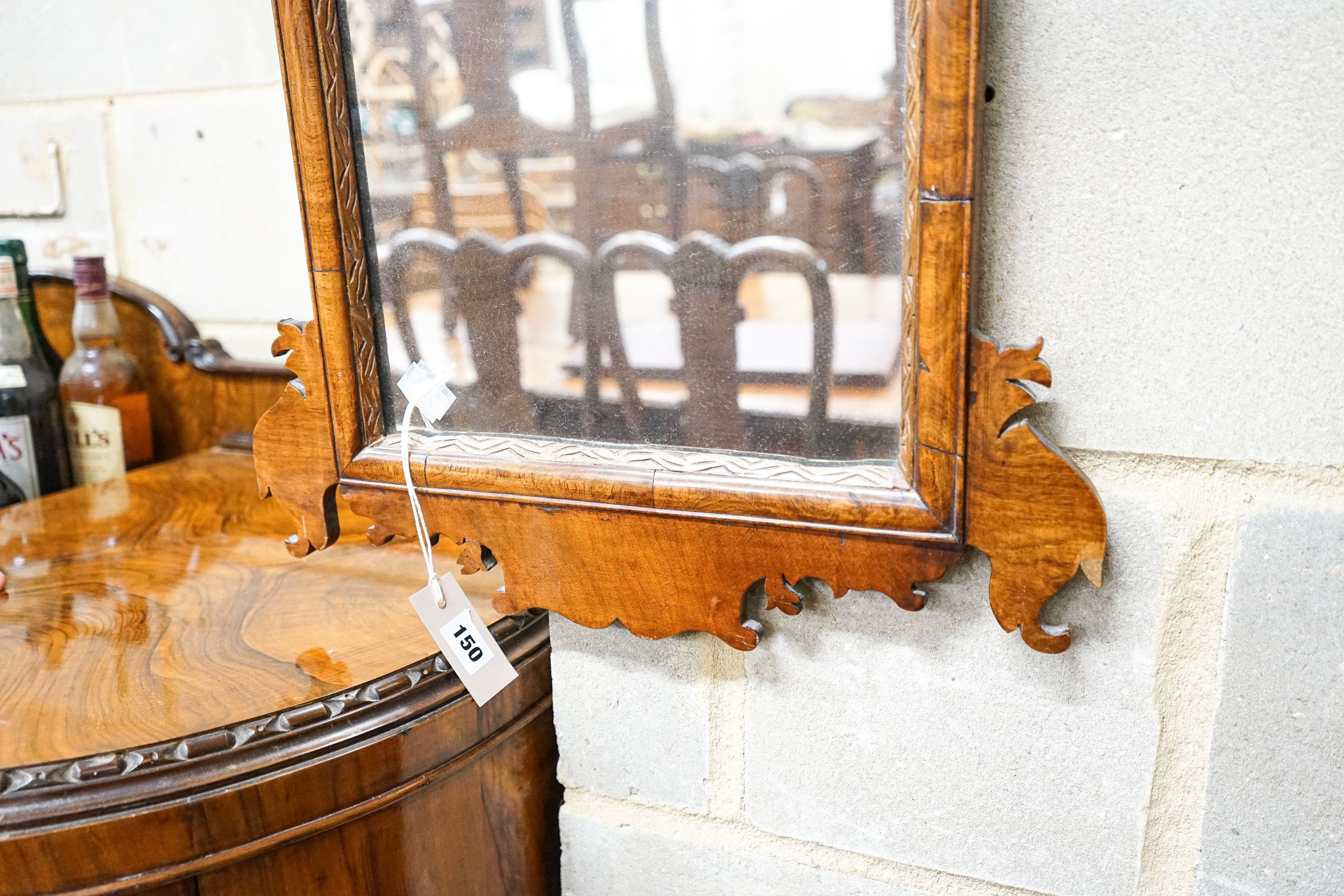 A George III style walnut fret cut wall mirror, width 47cm, height 66cm